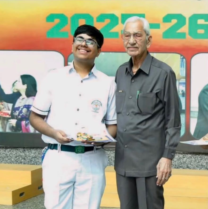 Ikshit Sethi receiving recognition as the highest Olympiad merit achiever from Director Principal Dr. U S Verma Sir